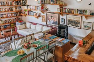 a living room with a table and a couch at Villa Robinson in Petrovac na Moru