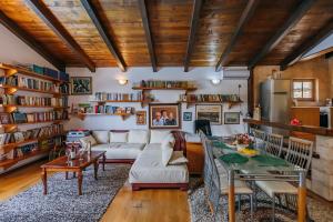 a living room with a couch and a table at Villa Robinson in Petrovac na Moru