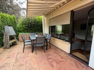 a patio with a table and chairs on it at Landhaus zur Sonne in Bad Camberg
