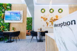 a conference room with chairs and a projection screen at Boulevard Hotel in Aytos