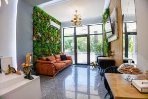 a living room with a couch and a table at Boulevard Hotel in Aytos