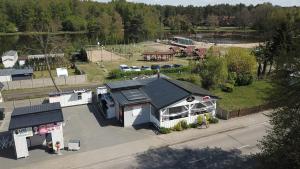 an overhead view of a building with a park in the background at Apartament nad jeziorem Rosnowo in Rosnowo