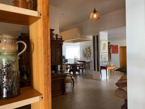a living room with a table and a dining room at City Hall Apartments in Borgarnes