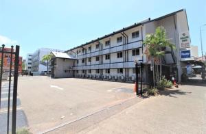 an empty parking lot in front of a building at Darwin city Studio in Darwin