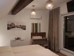 Postel nebo postele na pokoji v ubytování PENTHOUSE Griemann 2 für max 4 Personen mit eigener großer Dachterrasse zum Relaxen!