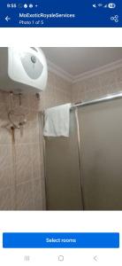 a bathroom with a shower and a sink at Mo Exortic Royale Services in Ikorodu