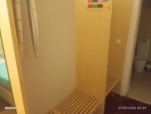 a small room with a door to a bathroom at Telhado solitario in Porto