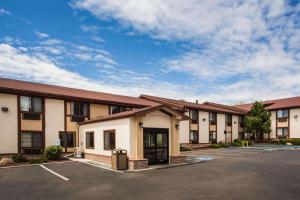 a row of apartment buildings with a parking lot at Super 8 by Wyndham Flagstaff in Flagstaff