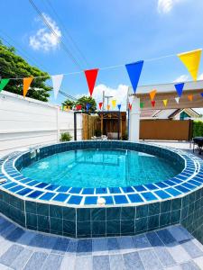a large swimming pool with a blue at X2 privacy villa in Khon Kaen