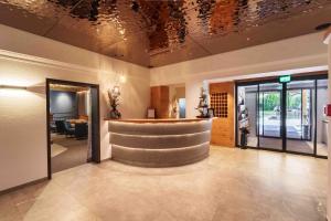 a lobby with a bar in a building at Hotel Pongauerhof in Flachau