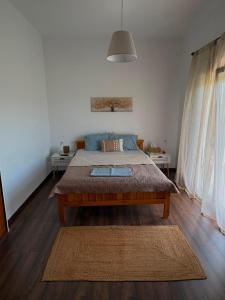 a bedroom with a large bed in a room at Village Memories in Koronópoulon