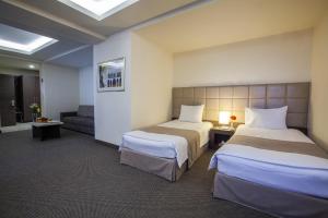 Postel nebo postele na pokoji v ubytování Aviatrans Hotel