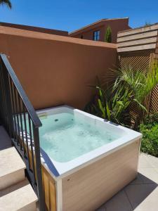 a hot tub on the side of a house at Arcasa Villas Collection by Omilos Hotels in Archanes +51 photos