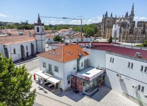 an overhead view of a city with a building at Alojamento Local Vitoria in Batalha