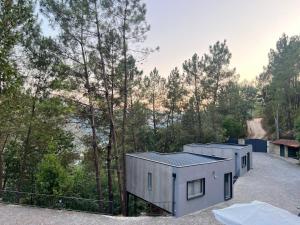 a rendering of a house in the woods at Gerês Hideaway in Vilar da Veiga