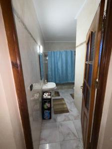 a bathroom with a sink and a toilet in it at Samadis Home 3 in Larache