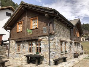 a building that is made out of wood at Mountain hut 'la Fraccia' in Trasquera