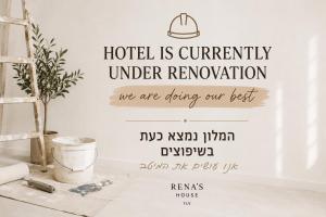 a hotel is currently under renovation wall decal in a room at Rena's House Smart Hotel in Tel Aviv