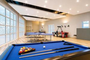 a billiard room with blue tables and balls on it at North Devon Getaways in Ilfracombe