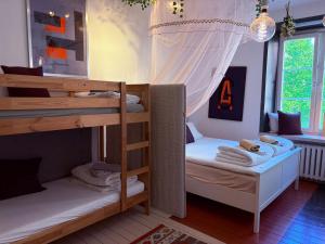 a bedroom with two bunk beds and a window at OW, by A&J - Familj & Bilen & Hunden - Liseberg & Avenyn! in Gothenburg