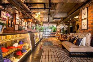 a store with a couch in the middle of a room at Rosa Malacca in Melaka