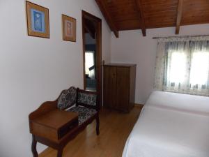 Postel nebo postele na pokoji v ubytování Hostal El Recanto