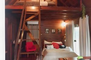 a bedroom with a bunk bed and a ladder at Cabana Andorinha in Três Coroas +45 photos