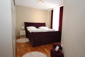 a small bedroom with a bed and a window at Elegant Villa Hariz near Poreč - Fully AC & Large Pool in Gedići +19 photos