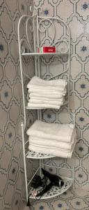 a towel rack with towels on it in a bathroom at Minerva in Viareggio +96 photos