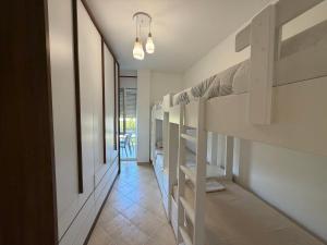 a hallway with bunk beds in a room at Near movenpic apartament in Draç
