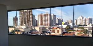 a large window with a view of a city at Vila Suites hotel in Vila Velha