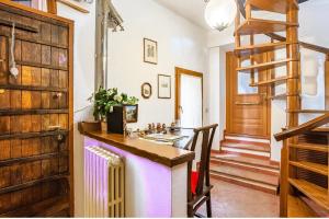 a kitchen with a sink and a wooden door at Zanna Casa Vacanza a soli 450 mt dal mare in Grottammare