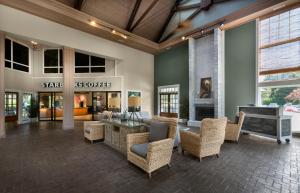 a lobby of a store with chairs and a table at Litchfield Beach & Golf Resort in Pawleys Island