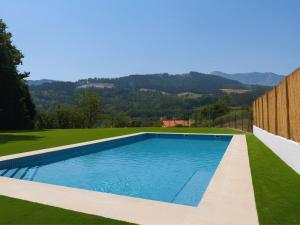 a swimming pool in the middle of a yard at Solatsu Baserria - Apartamentos Rurales in Elorrio