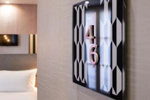 Postel nebo postele na pokoji v ubytování Hotel Duette Paris