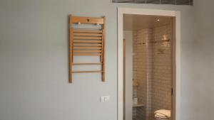 a bathroom with a walk in shower and a toilet at Florentin House with MAMAK - By HOMY in Tel Aviv +70 photos
