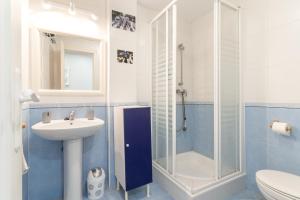 a bathroom with a shower and a sink and a toilet at Bellavista Los Pinos in Almuñécar +20 photos