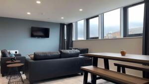 a living room with a couch and a table at The Coal Yard in York