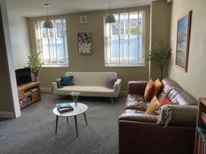 a living room with a couch and a table at Apartment in Constantine in Constantine