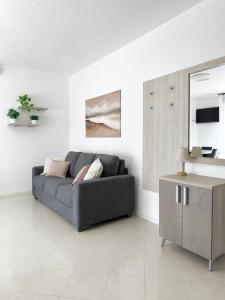 a living room with a couch and a table at Emy Dreams in Citta' Sant'Angelo