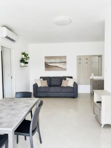 a living room with a couch and a table at Emy Dreams in Citta' Sant'Angelo