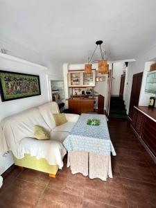 a living room with a couch and a table at Alcalá Zona Centro Duplex in Alcalá la Real