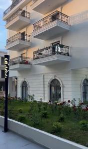 a building with balconies on the side of it at Aura Stay Apartment in Tirana