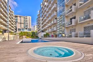 a swimming pool in the middle of a building at Vista Mar Concórdia by Rentallido in Funchal