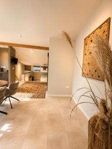 a living room with a couch and a table at De Meuleberg Boutique Suites in Melick