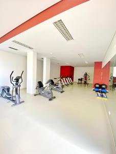 a gym with bikes and exercise equipment in a building at Vista Mar Concórdia by Rentallido in Funchal