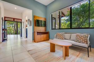 a living room with a couch and a table at Casa Carmen in Potrero