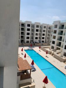 a view of the pool from the balcony of a apartment at Studio in Porto Said Compound in Port Said