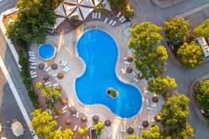 an overhead view of a swimming pool at a resort at Kampaoh Tavira in Tavira