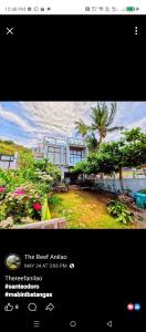 a screenshot of a house with a picture of a house at The Reef Anilao in Mabini